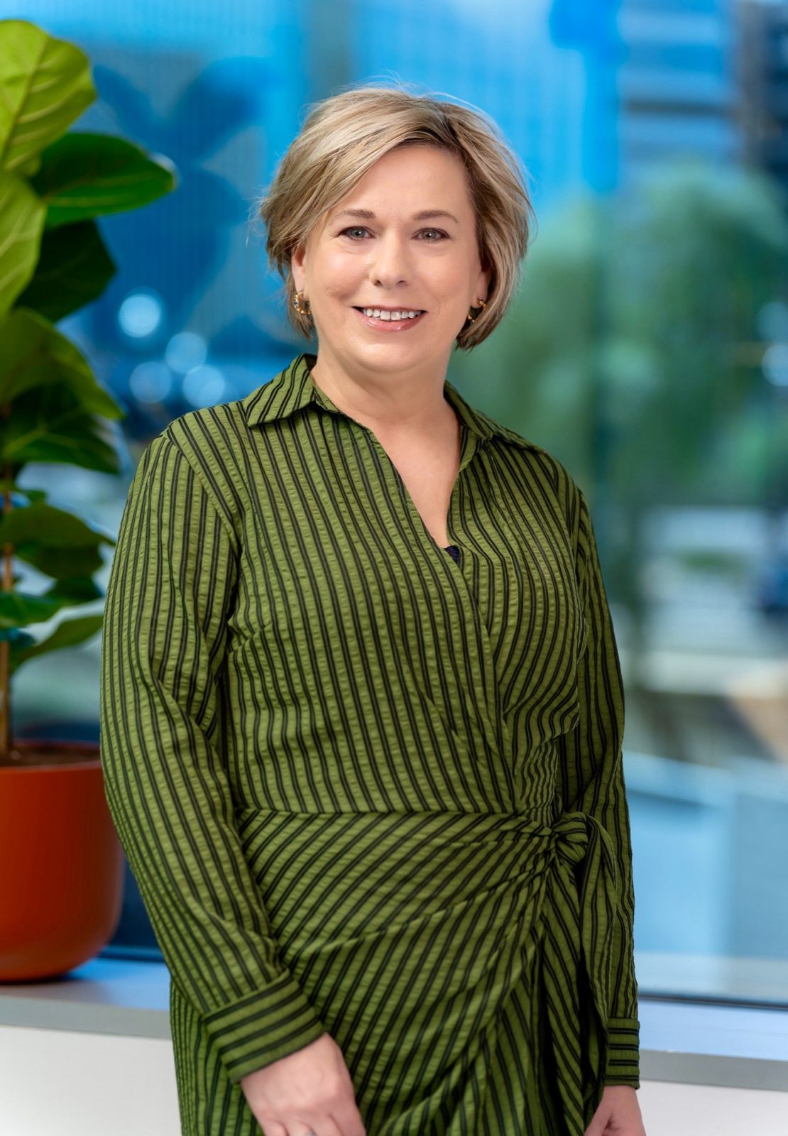 Corporate headshot on location in Tempe, lit with a bounced light and a large umbrella fill in a conference room