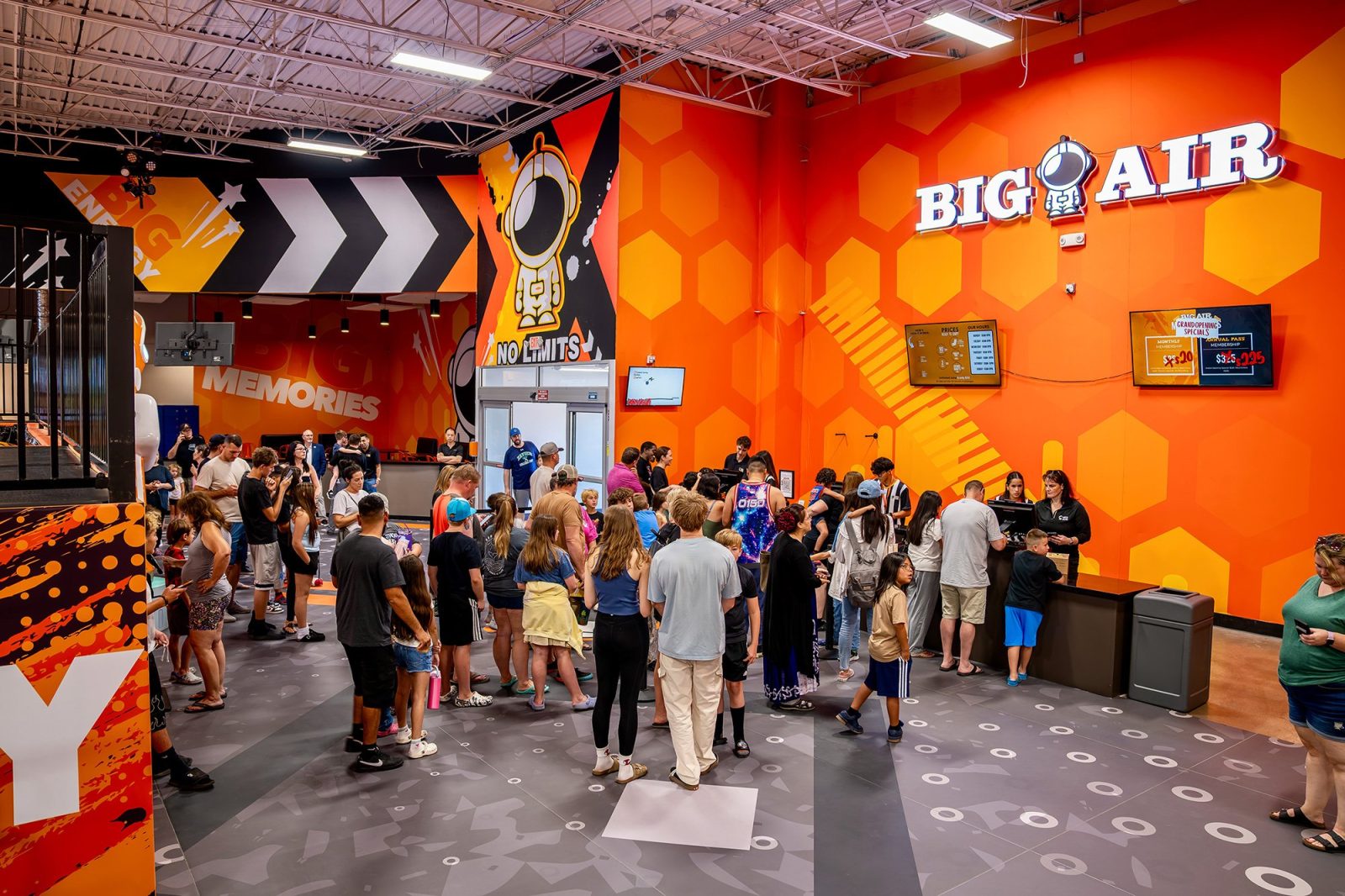 Event photography of the Big Air Glendale grand opening in Glendale, Arizona, showing crowds of families at the entrance of the new indoor trampoline park — captured by Timothy Fox Photography & Video, Phoenix event photographer
