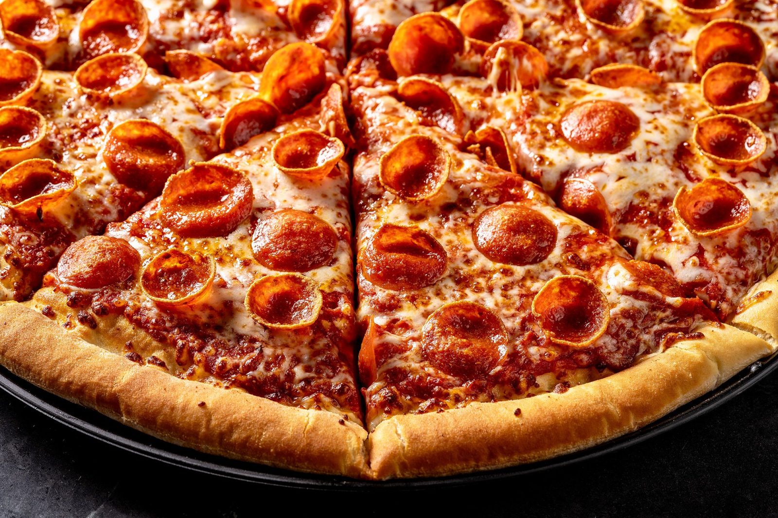 Food photography of pepperoni pizza from Big Eats snack bar at Big Air Glendale trampoline park