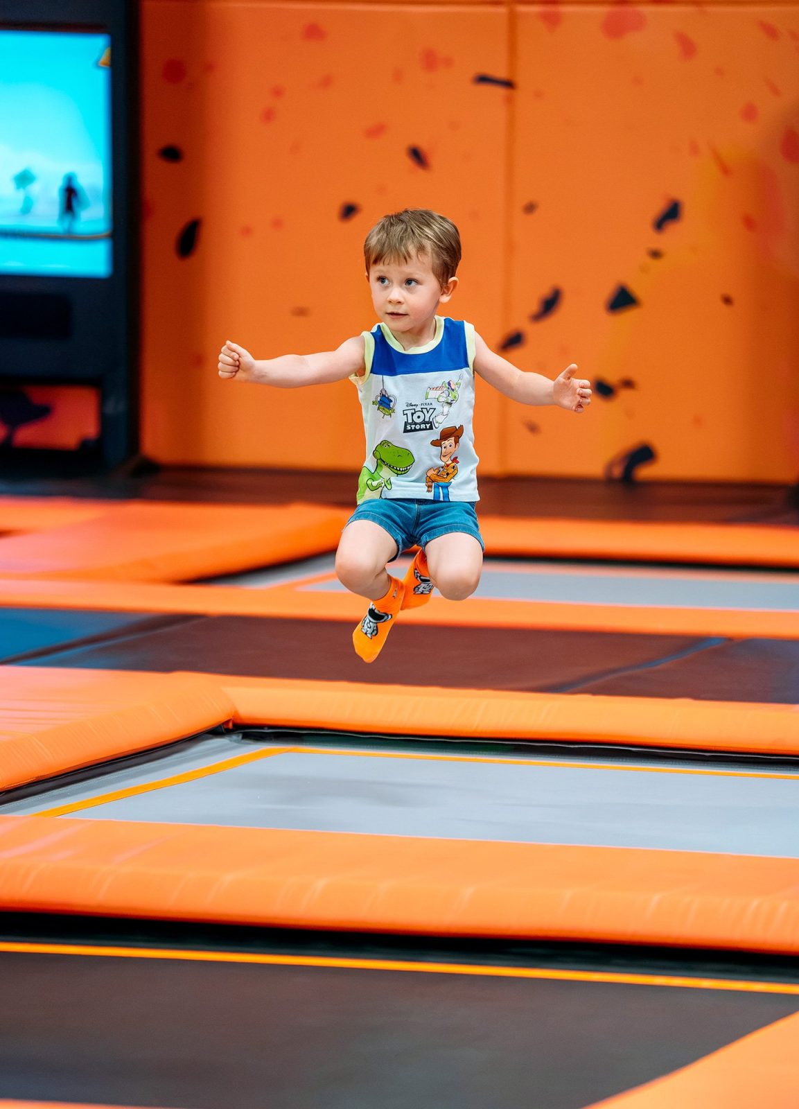 Action photography of a young boy jumping mid-air on the trampolines at Big Air Glendale in Arizona