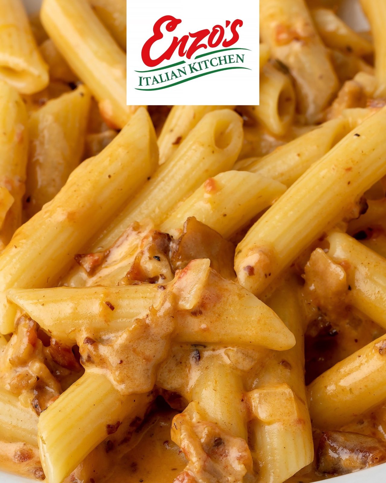 Close-up of penne alla vodka in a creamy pink sauce at Enzo's Italian Kitchen