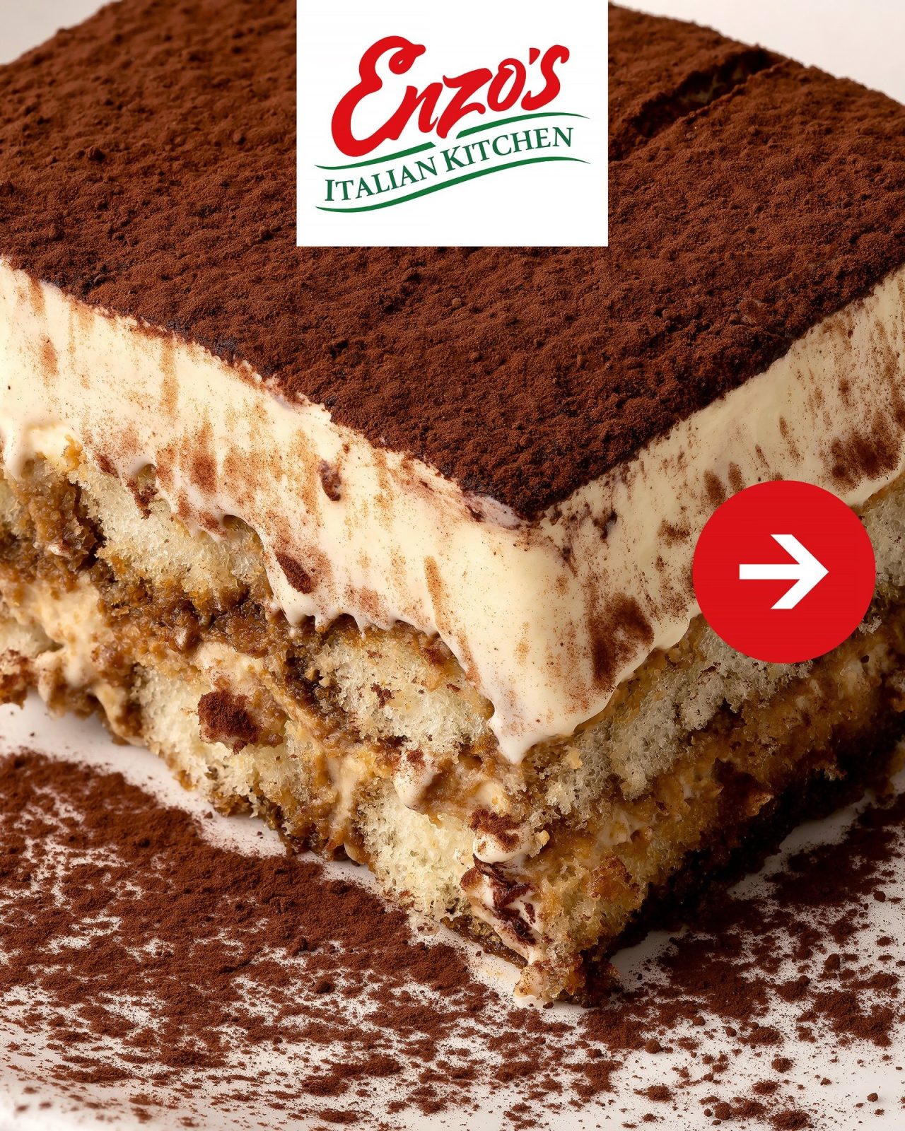 Close-up of a square of tiramisu dusted with cocoa at Enzo's Italian Kitchen
