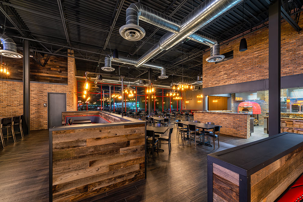 Taphouse Grill Interior photo of the restaurant in glowing lights at evening time