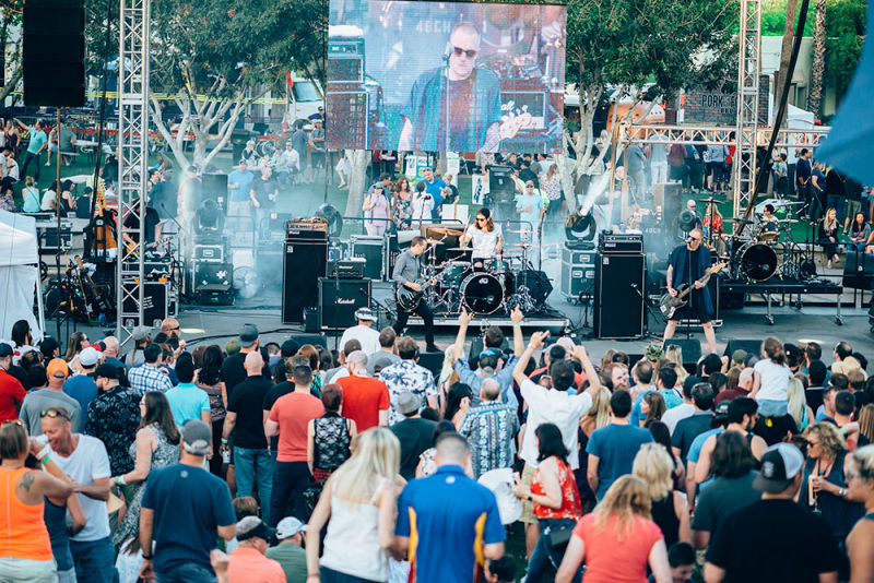 Eve 6 on stage with a large audience