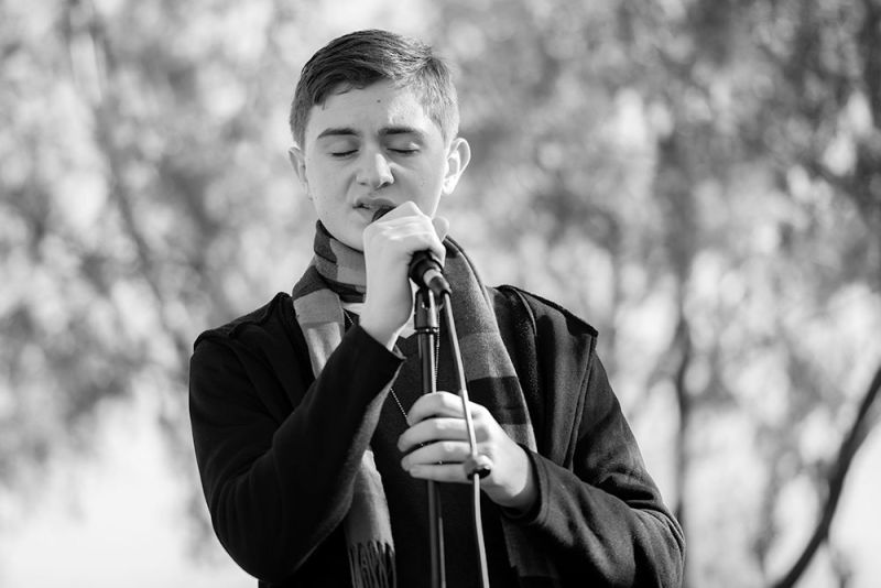 Young man singing in the snow