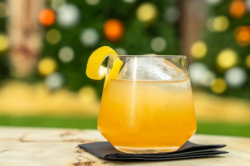 Yellow cocktail at the Arizona Biltmore with Christmas decorations in the background