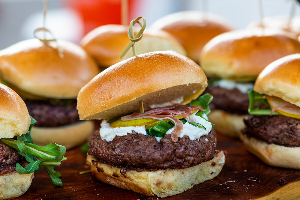 Bunch of mini burger sliders at an event tasting