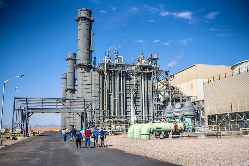 Site tour group walking toward a generating unit at Capital Power's Harquahala facility in Arizona — photo 12