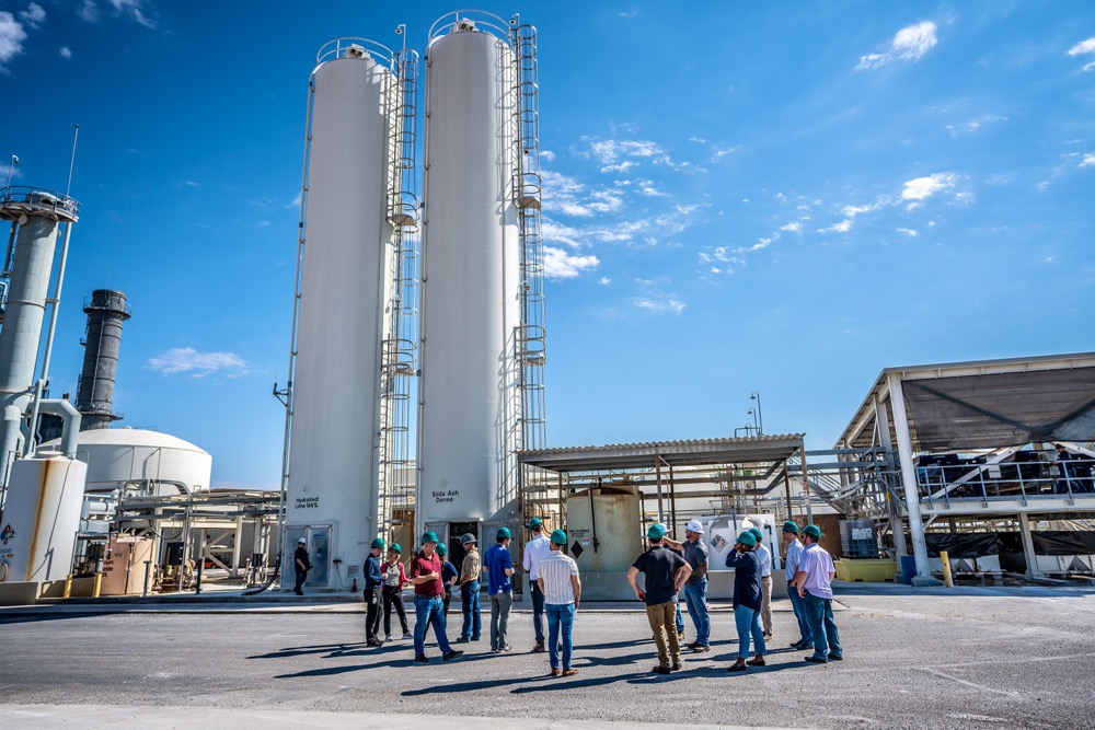 Site tour group beside storage silos at Capital Power's Harquahala facility in Arizona — photo 16