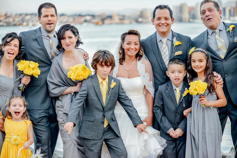 A wedding party being rowdy during a photoshoot