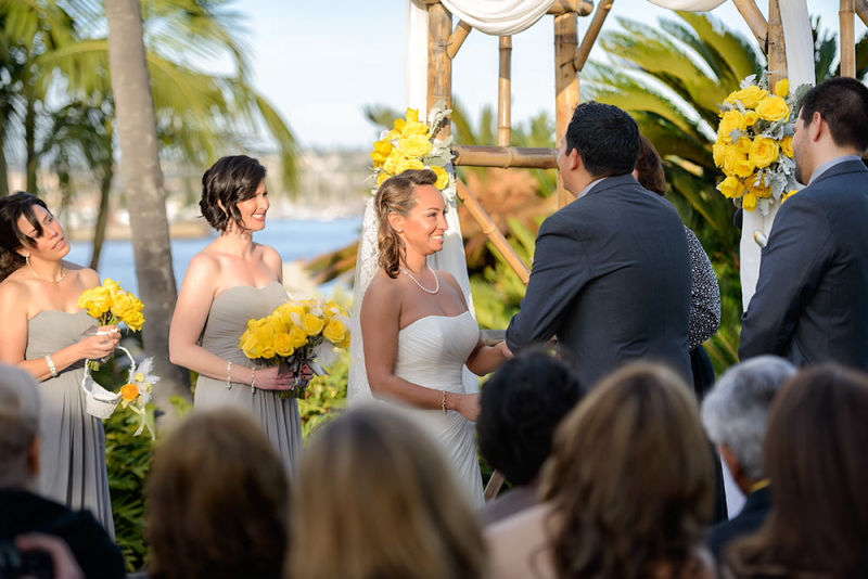 Wedding service with yellow flowers with the beach in the background