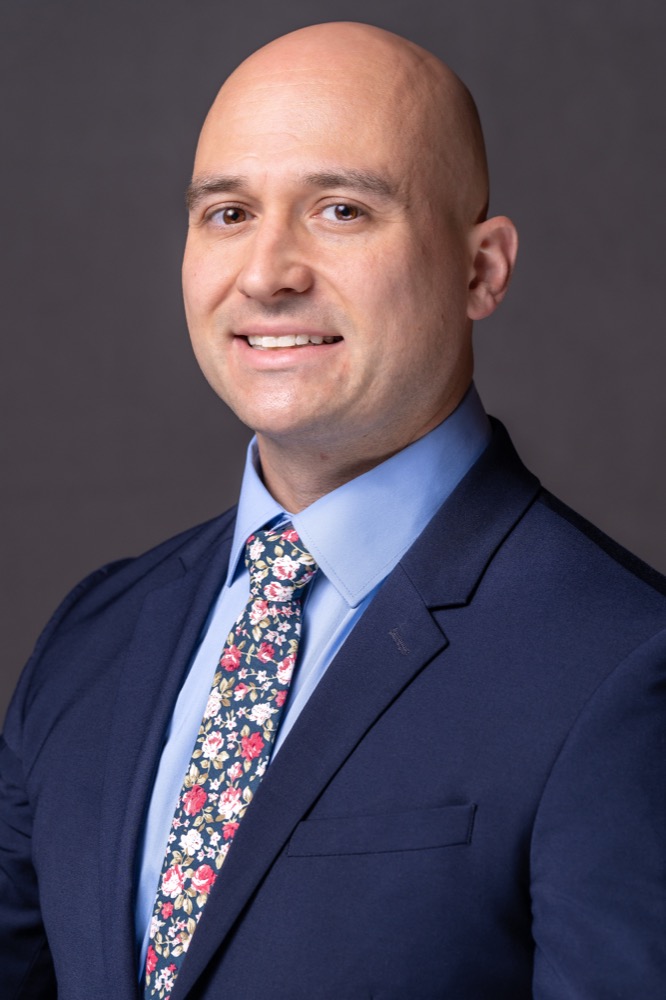 Corporate headshot on a gray studio backdrop in Phoenix, Arizona — photo 6