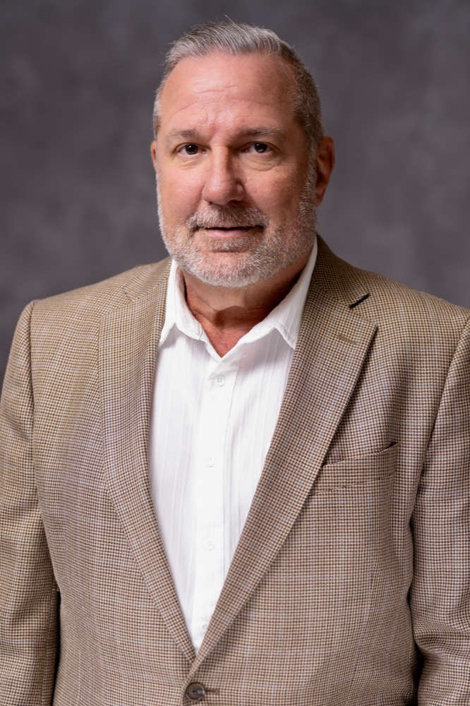 Business headshot on a studio backdrop in Phoenix, Arizona — photo 10