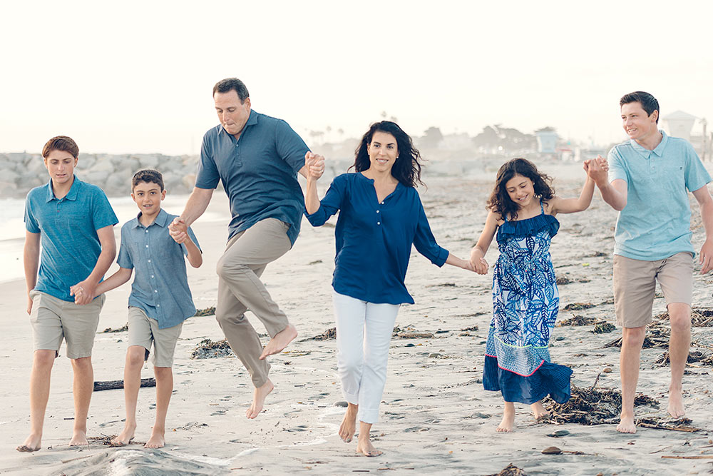 A family walking on the beach lifestyle captured action