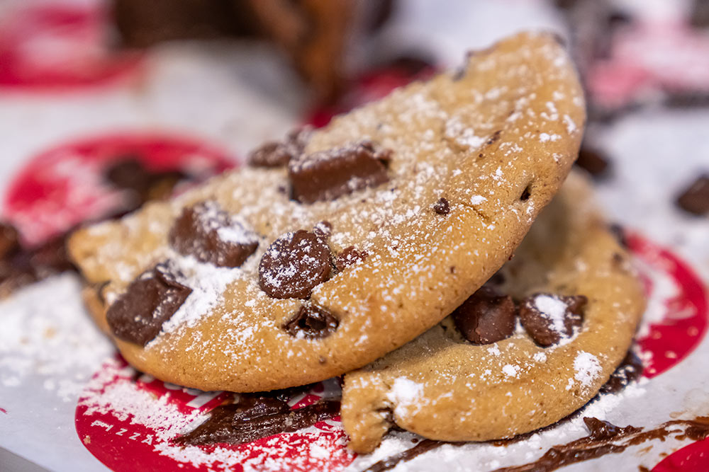 Chocolate chip cookies with powered sugar side view