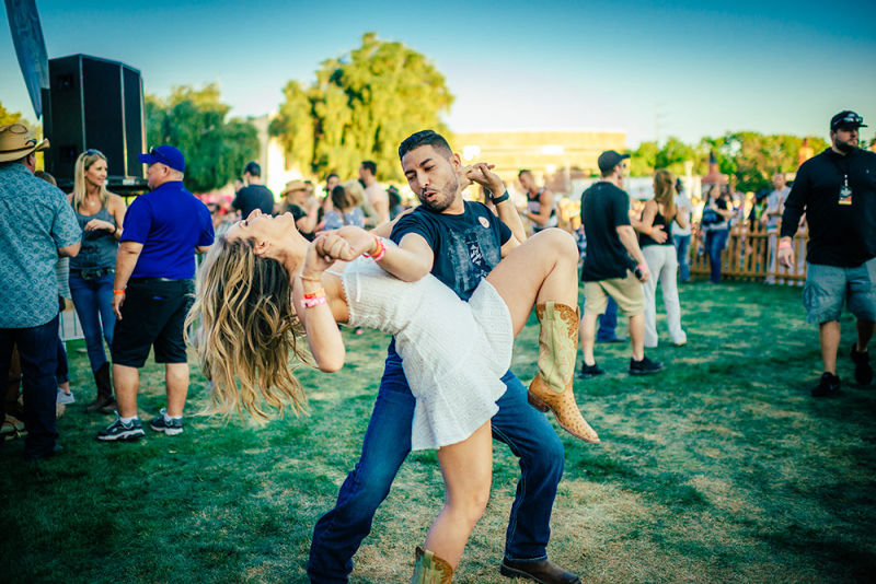 Taking a dancing dip on the green grass during a performance