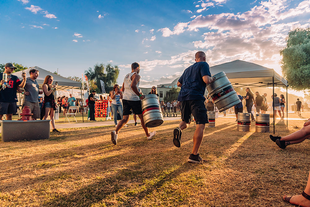 A keg race with a beautiful sunset