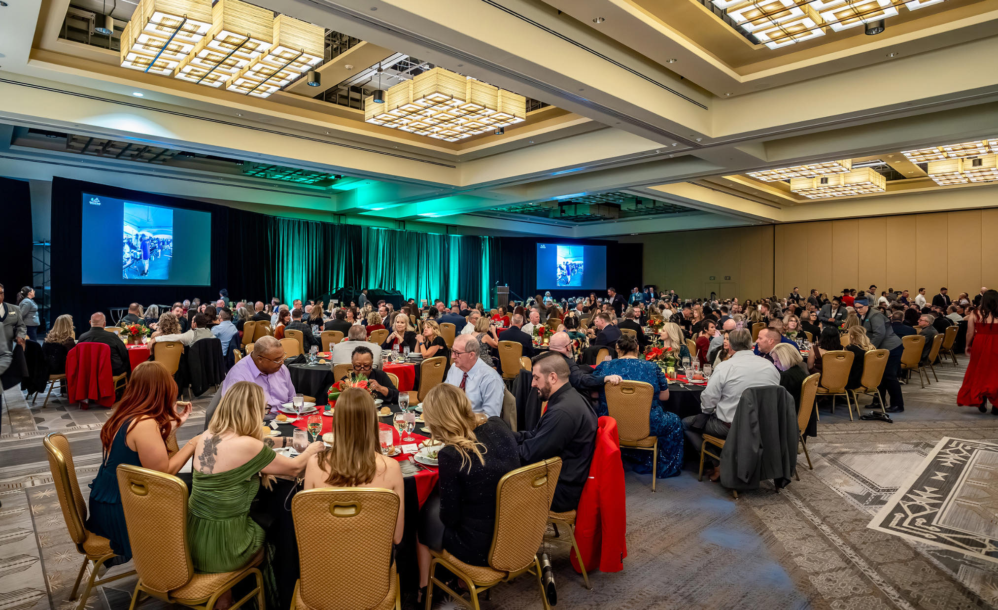 Guests seated for dinner at a gala in a Phoenix hotel ballroom, photographed by Timothy Fox Photography & Video