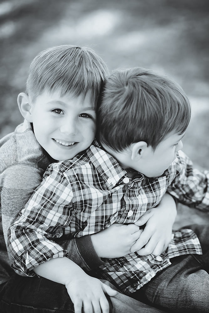 Black and white pose with 2 little brothers being silly