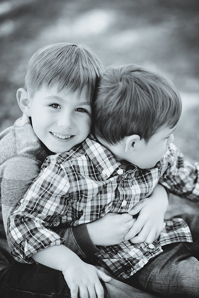 Black and white pose with 2 little brothers being silly