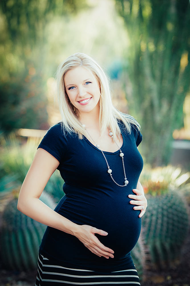 Pregnant woman glowing in the sunlight