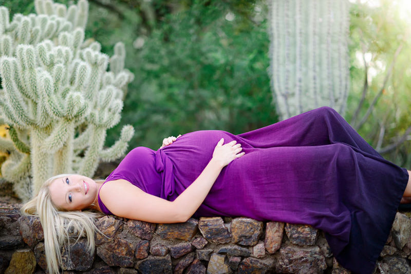 Sun-kissed pregnant lady in a striking ensemble