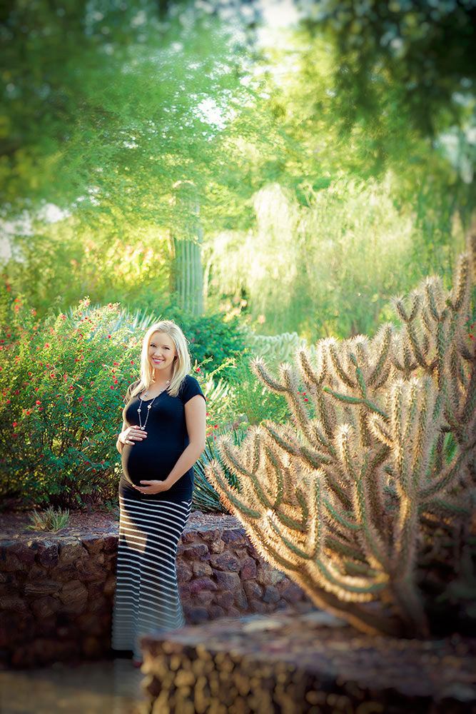 Radiant pregnant woman basking in the desert sun