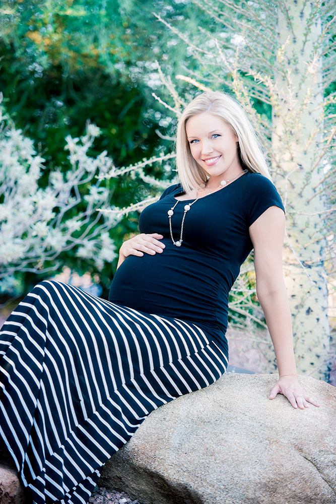 Serene pregnant woman enjoying nature's beauty