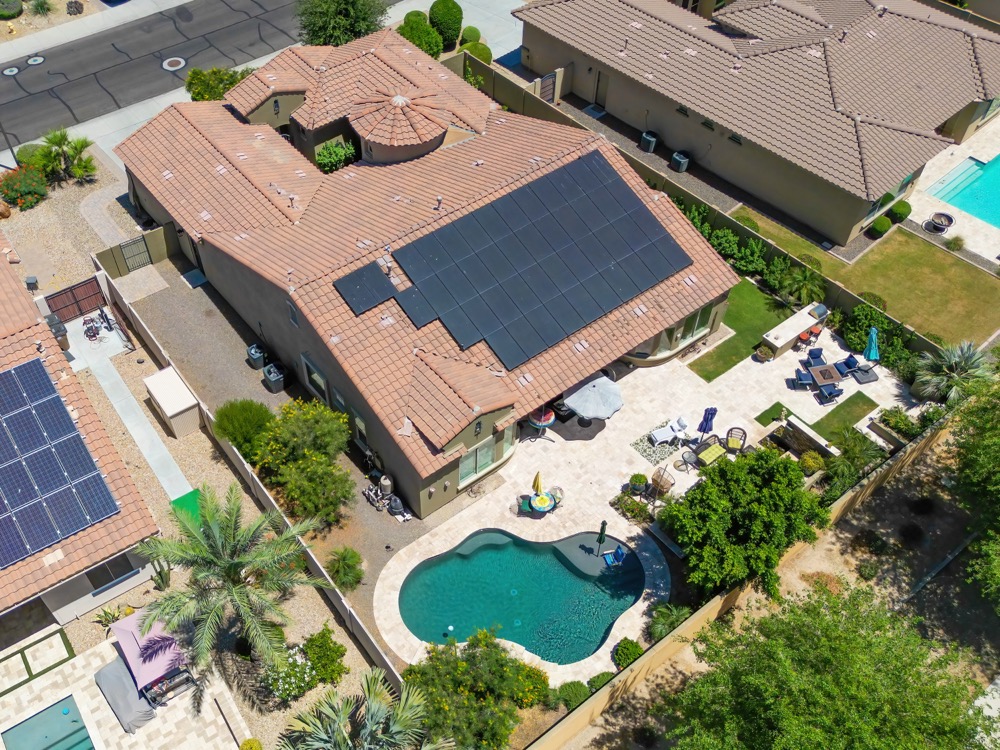 Angled drone view of a home, pool and neighboring lots in the Phoenix area — photo 4
