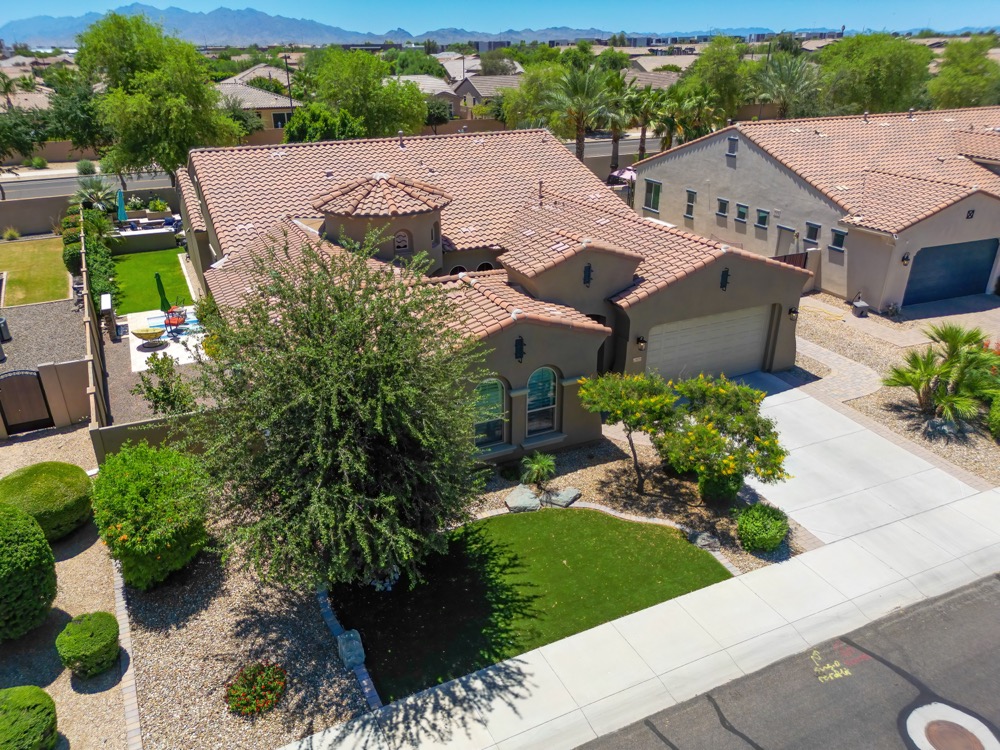 Aerial of a home and street with mountains on the horizon in the Phoenix area — photo 5