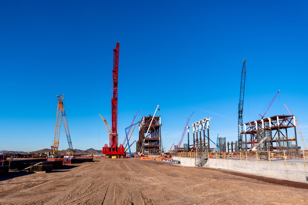 Cranes and early steel on the TSMC Arizona fab construction site in north Phoenix — photo 1