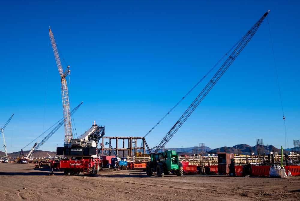 Lattice boom cranes and heavy equipment on the TSMC Arizona construction site in Phoenix — photo 2