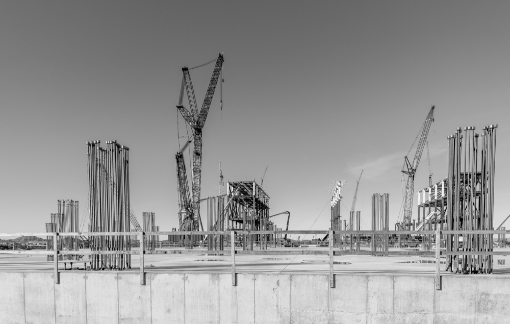 Black and white view of steel framing and cranes on the TSMC Arizona site in Phoenix — photo 6