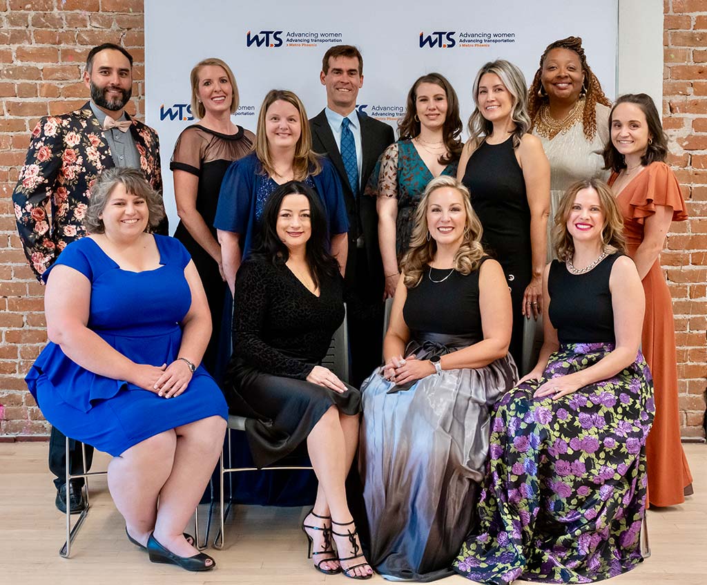 Professional staff photo captured in front of a WTS Metropolitan Phoenix Chapter event step and repeat backdrop